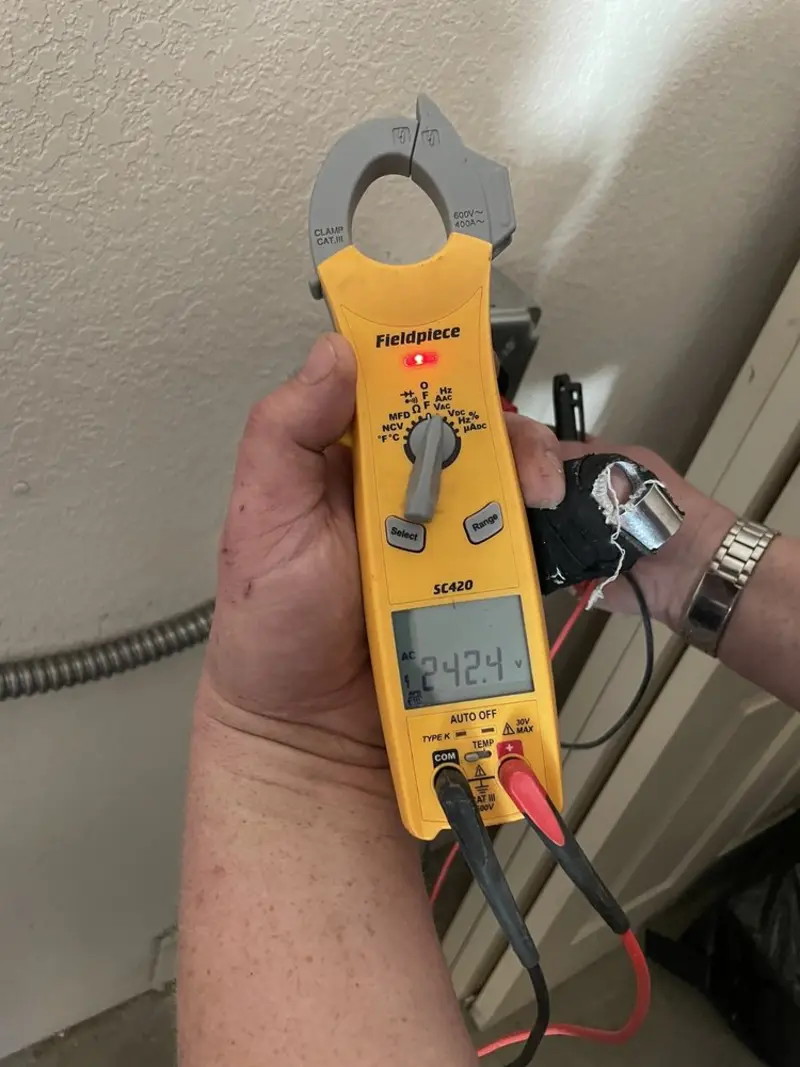 Voltage testing with clamp meter during Ceiling Fan Installation in Belle Plaine